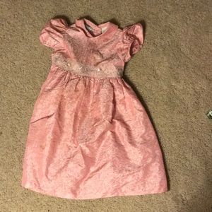 Girly, poofy pink princess dress.